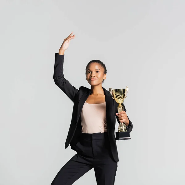 Smiling African American Businesswoman Performing Ballet Golden Cup Isolated Grey — Stock Photo, Image