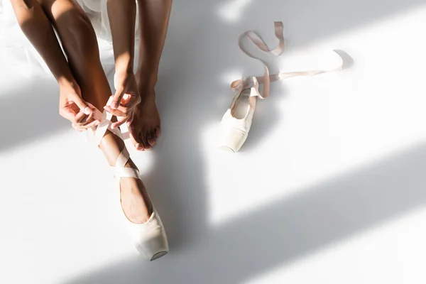 Cropped View Graceful African American Ballerina Tying Pointe Shoes White — Stock Photo, Image