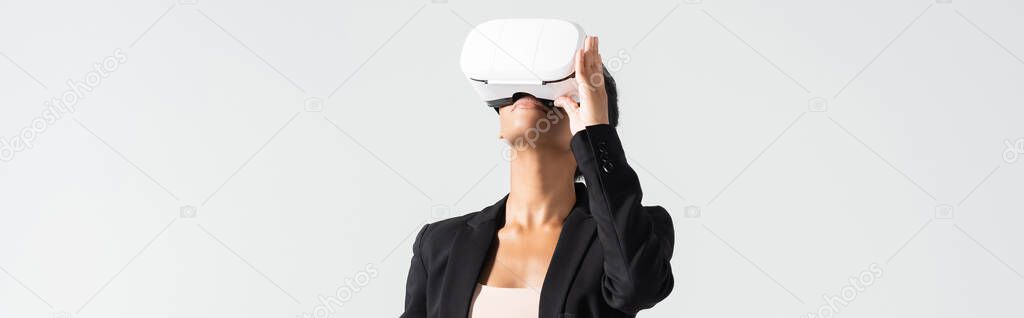 african american businesswoman in vr headset isolated on white, banner
