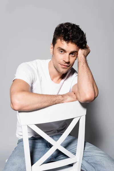 Young Man White Shirt Sitting Chair Isolated Grey — Stock Photo, Image