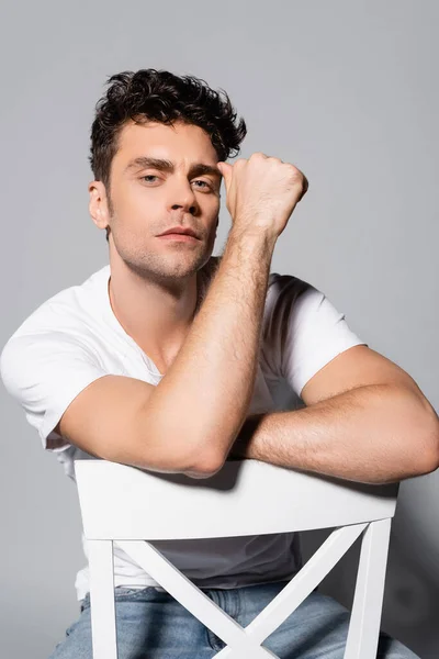 Young Man White Shirt Sitting Chair Isolated Grey — Stock Photo, Image