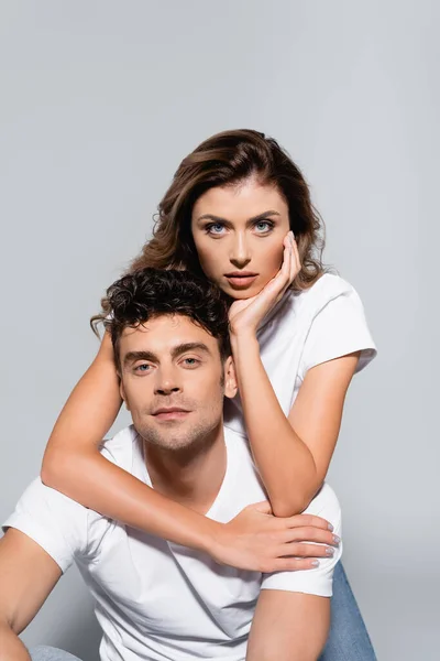 Young Couple White Shirts Embracing Isolated Grey — Stock Photo, Image