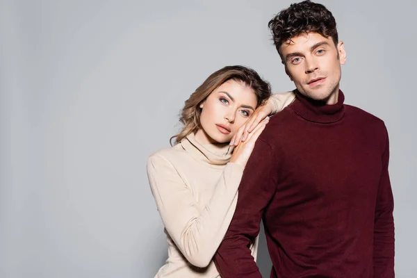 Casual Young Couple Turtleneck Jumpers Embracing Isolated Grey — Stock Photo, Image