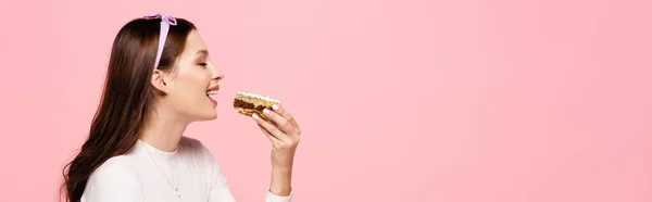 Young Pretty Woman Eating Cake Isolated Pink Banner — Stock Photo, Image