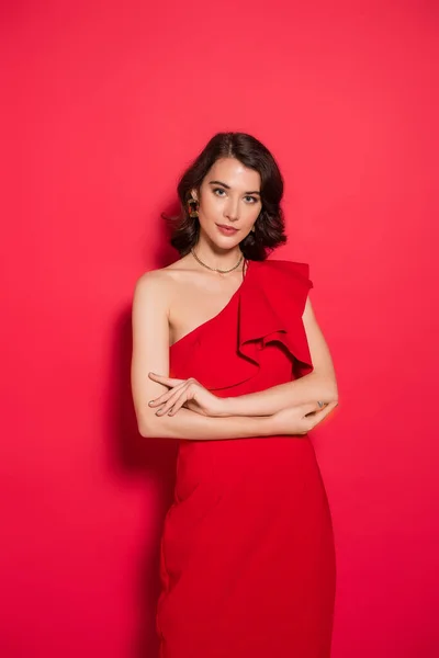 Young Brunette Woman Red Dress Looking Camera Red Background — Stock Photo, Image