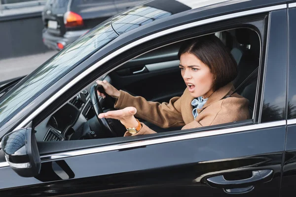 Angry Woman Screaming Pointing Hand Side Window While Driving Car — Stock Photo, Image