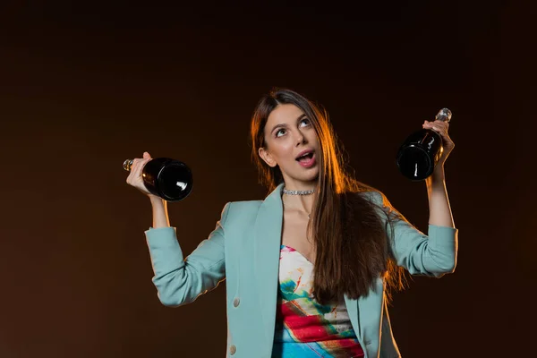 Surprised Brunette Woman Jacket Holding Bottles Champagne Black — Stock Photo, Image