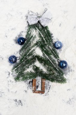 top view of decorated Christmas tree on snow clipart