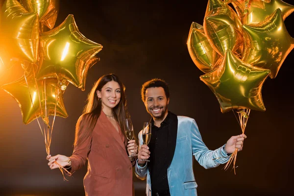 Smiling Interracial Couple Holding Glasses Champagne Balloons Black — Stock Photo, Image