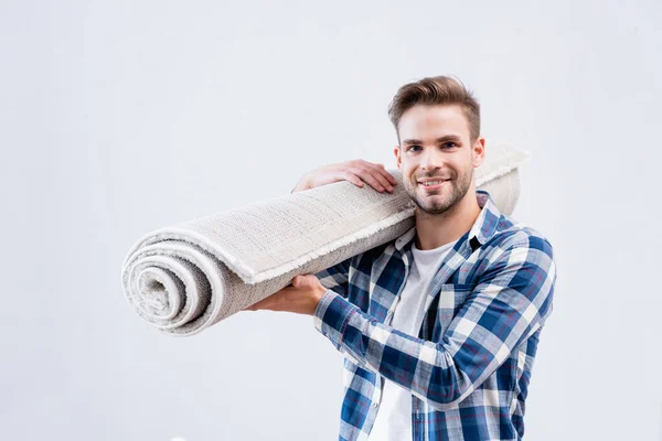 Feliz Joven Con Rollo Alfombra Mirando Cámara Aislada Blanco — Foto de Stock