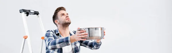 Young Man Looking While Holding Pot Leaking Ceiling Ladder Banner — Stock Photo, Image