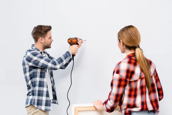 Back View Young Woman Frame Man Drilling Wall Home — Stock Photo, Image
