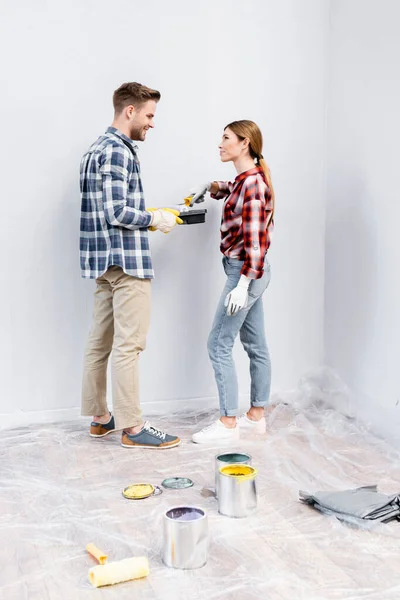 Full Length Happy Young Couple Paint Roller Tray Looking Each — Stock Photo, Image