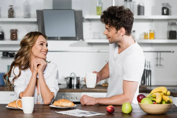 Woman Smiling Boyfriend Cup Newspaper Breakfast Kitchen — Stock Photo, Image