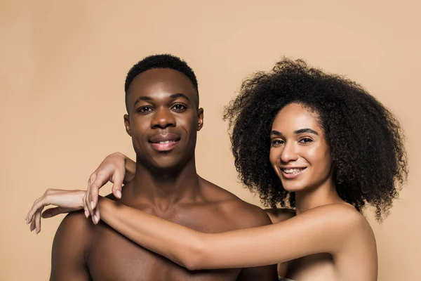 Curly African American Woman Bare Shoulders Hugging Cheerful Boyfriend Isolated — Stock Photo, Image