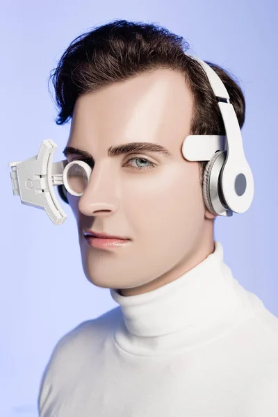 Brunette Cyborg Man Headphones Eye Lens Looking Camera Isolated Blue — Stock Photo, Image