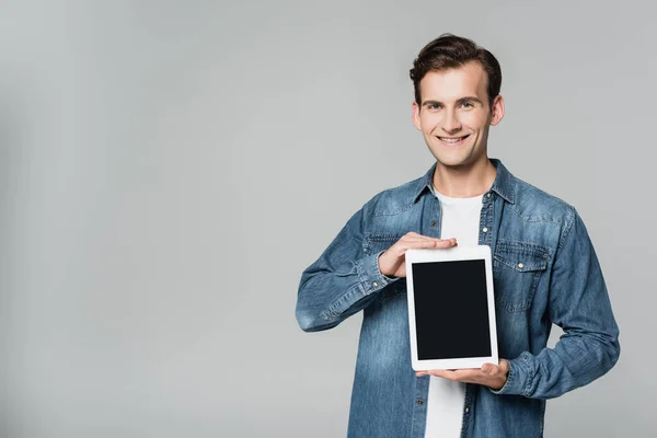 Positive Man Showing Digital Tablet Blank Screen Isolated Grey — Stock Photo, Image