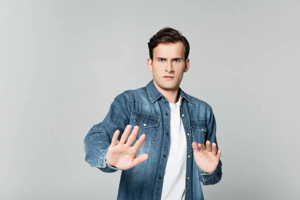 Scared Man Showing Stop Gesture Isolated Grey — Stock Photo, Image