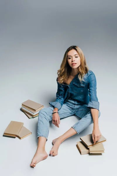 Young Barefoot Woman Denim Shirt Jeans Sitting Books Grey — Stock Photo, Image