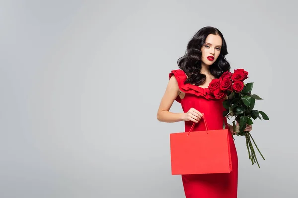 Young Woman Holding Shopping Bag Red Roses Isolated Grey — Stock Photo, Image