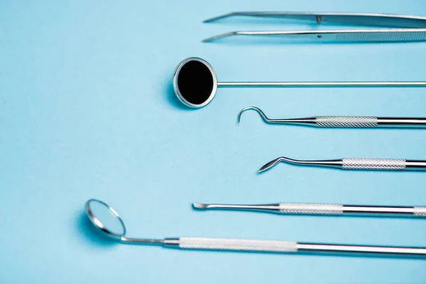 Close View Dental Mirror Tools Blurred Foreground Blue Background — Stock Photo, Image