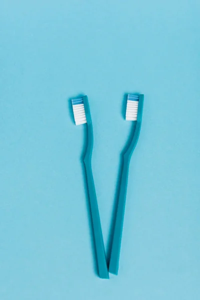 Top View New Toothbrushes Blue Background — Stock Photo, Image