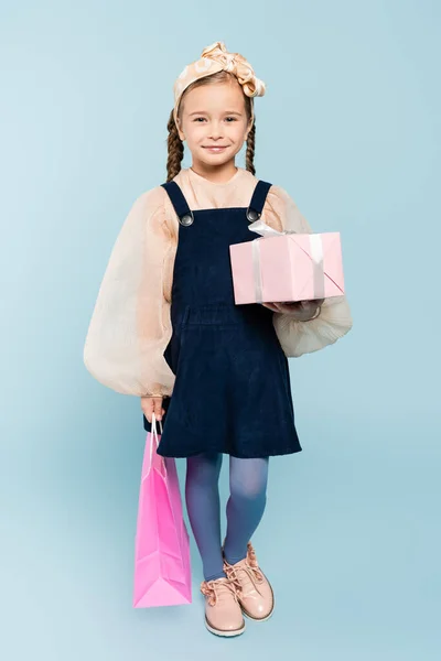 Full Length Happy Kid Pigtails Holding Shopping Bag Present Blue — Stock Photo, Image