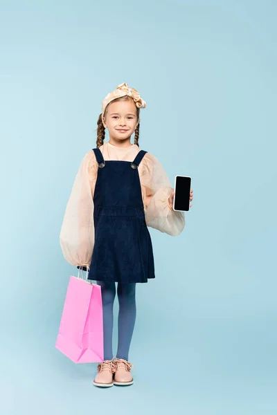 Full Length Happy Kid Pigtails Holding Smartphone Blank Screen Shopping — Stock Photo, Image