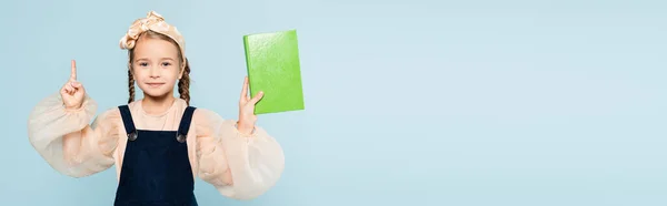 Little Girl Pigtails Holding Book Pointing Finger Isolated Blue Banner — Stock Photo, Image