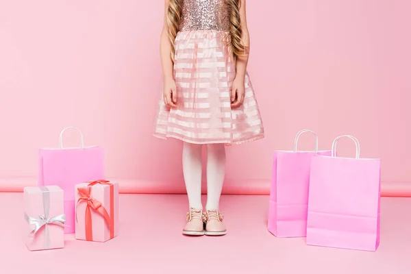 Cropped View Little Girl Dress Standing Presents Shopping Bags Pink — Stock Photo, Image