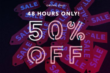 online only, 48 hours only, 50 percent off lettering near red labels on black background clipart