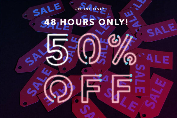 online only, 48 hours only, 50 percent off lettering near red labels on black background