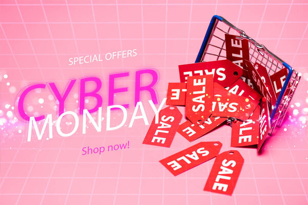 sale tags near shopping basket and special offers, cyber monday, shop now lettering on pink, black friday concept