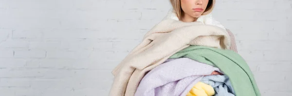 Cropped View Young Woman Holding Knitted Sweaters White Brick Wall — Stock Photo, Image