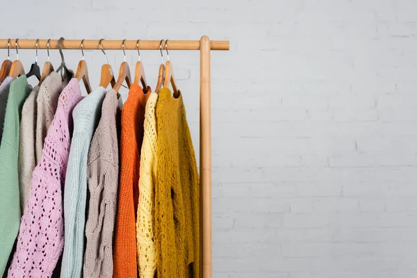 Wooden Hanger Rack Warm Sweaters White Background — Stock Photo, Image