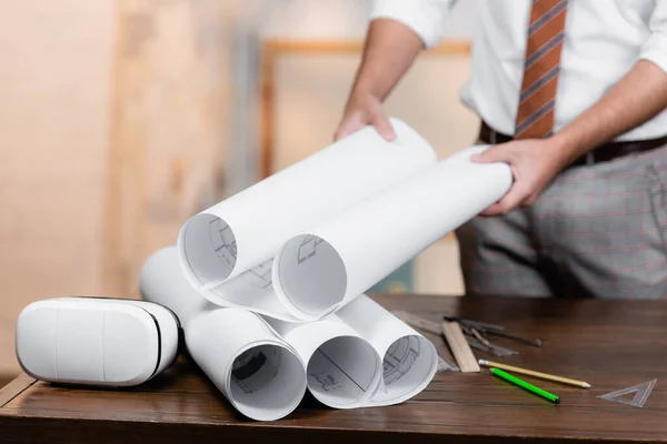 Cropped View Architect Holding Rolled Blueprint Headset Desk — Stock Photo, Image