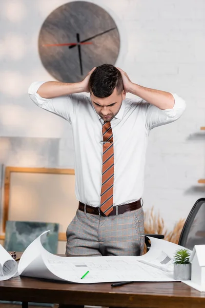 Thoughtful Architect Holding Hands Head Blueprint Desk — Stock Photo, Image