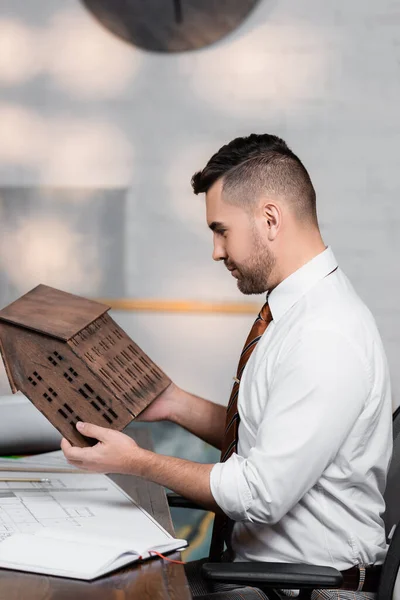 Side View Architect Holding House Model While Sitting Workplace — Stock Photo, Image