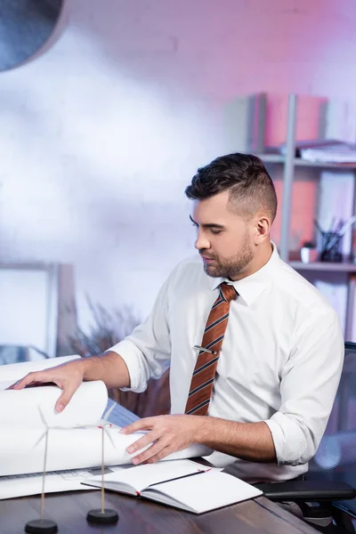 Architect Working Blueprints Models Wind Generators Blurred Foreground — Stock Photo, Image