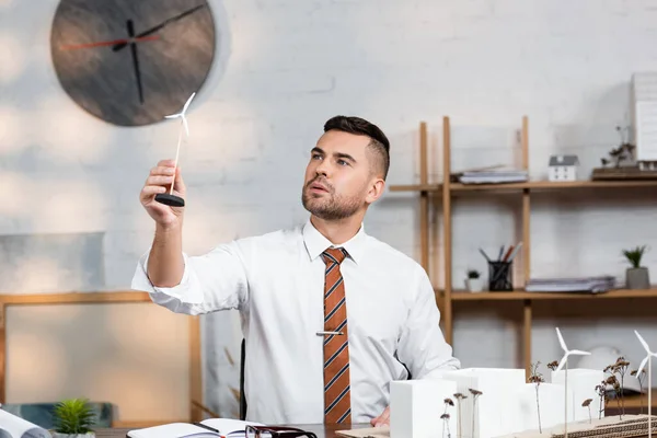 Architect Holding Model Wind Generator Architectural Project Workplace — Stock Photo, Image