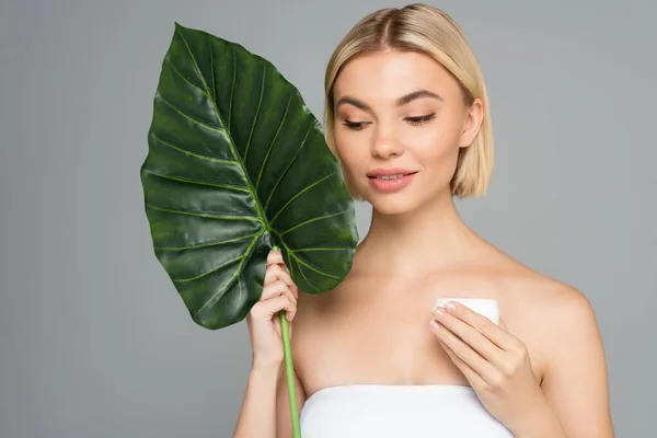 Blonde Woman Tropical Leaf Jar Cosmetic Cream Isolated Grey — Stock Photo, Image