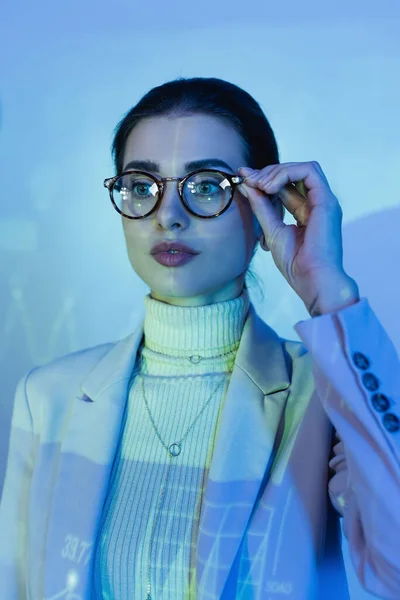 Businesswoman Suit Adjusting Glasses Looking Away Office — Stock Photo, Image