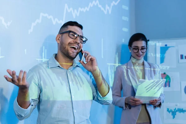 Cheerful Businessman Talking Smartphone Coworker Glasses Documents Blurred Background — Stock Photo, Image