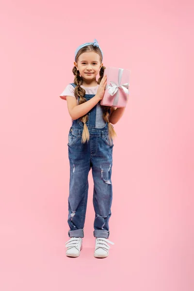 Full Length Happy Kid Smiling Holding Present Pink — Stock Photo, Image