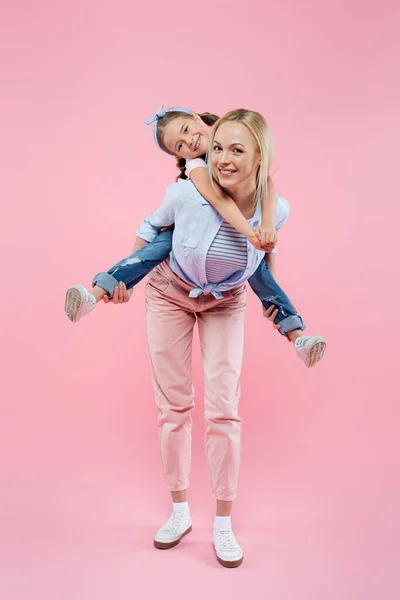 Full Length Happy Mother Piggybacking Daughter Pink — Stock Photo, Image