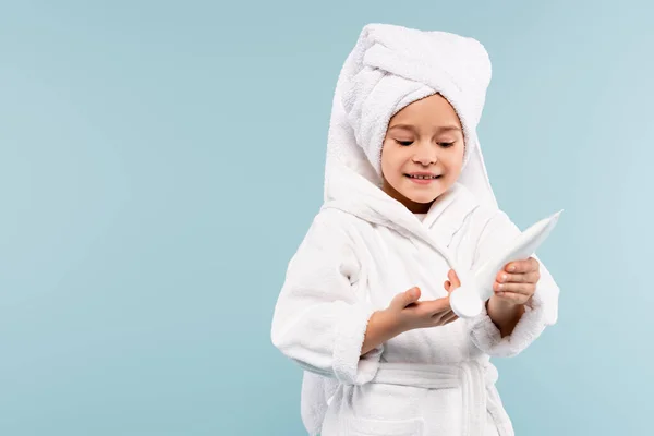 Smiling Kid Bathrobe Towel Head Holding Tube Cosmetic Product Isolated — Stock Photo, Image