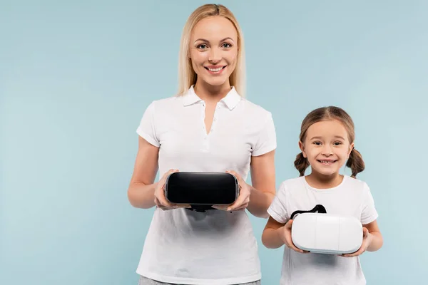 Cheerful Mother Kid Holding Headsets Isolated Blue — Stock Photo, Image