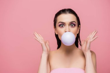 surprised woman with bare shoulders blowing bubblegum isolated on pink clipart