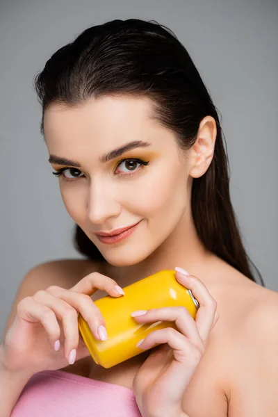 Sly Young Woman Holding Yellow Can Soft Drink Isolated Grey — Stock Photo, Image