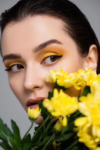 Young Brunette Woman Makeup Blooming Yellow Flowers Blurred Foreground Isolated — Stock Photo, Image